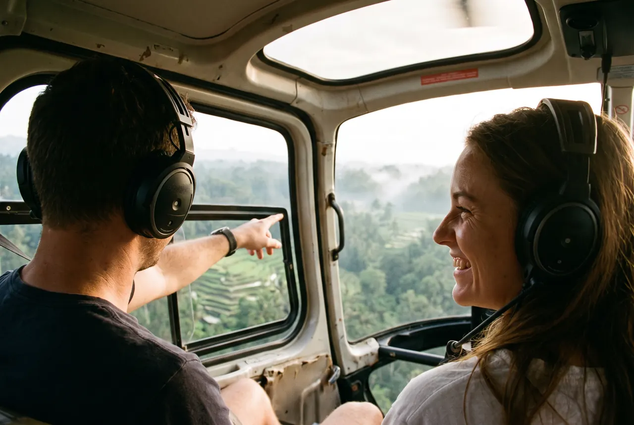 Couple in headsets looking at the Ubud rice terraces from a helicopter cabin