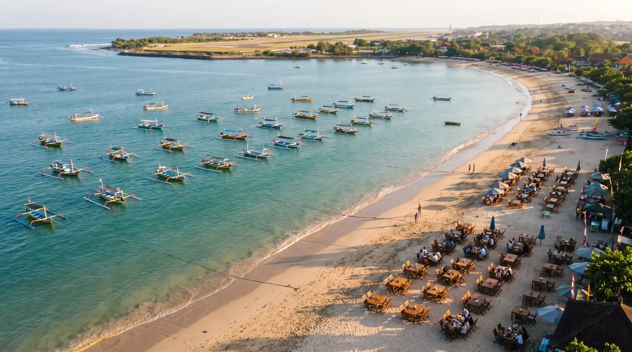 Jimbaran Bay beach and fishing boats from a helicopter in Bali