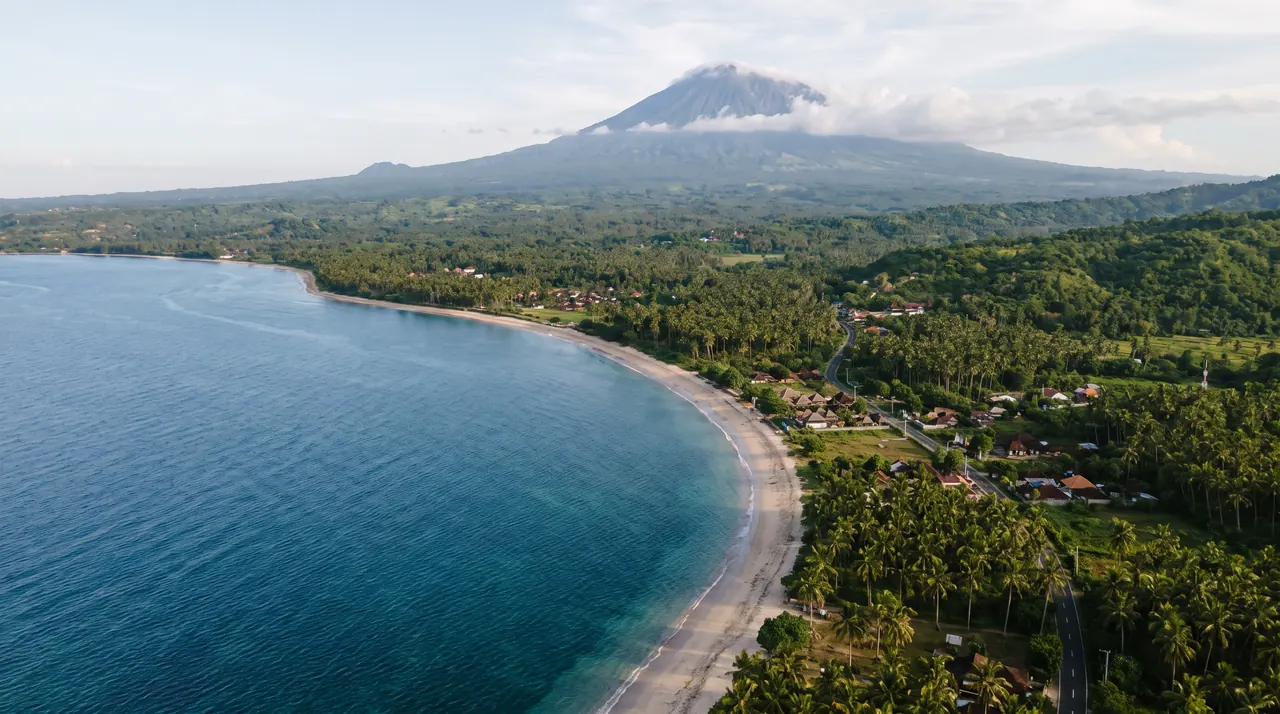 Lombok coastline with Mount Rinjani behind, seen from a helicopter