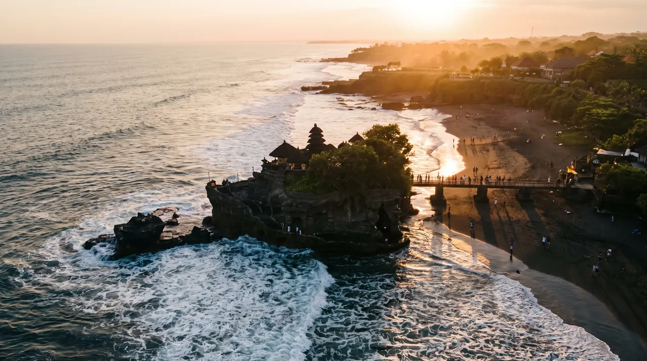 Tanah Lot sea temple at sunset seen from the air in Bali