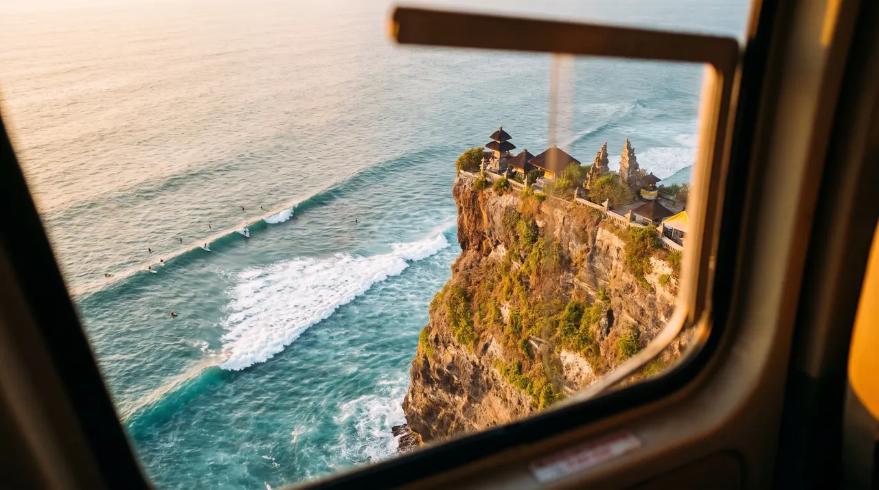 Uluwatu temple on its sea cliff seen from a helicopter in Bali